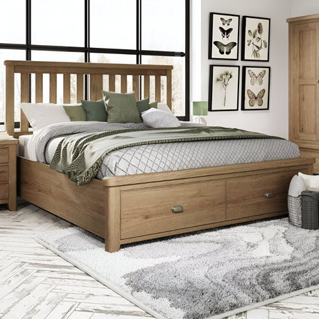 Wooden storage bed with slatted headboard and built-in drawers, styled with layered bedding and placed in a bright bedroom featuring a textured rug and neutral decor accents.