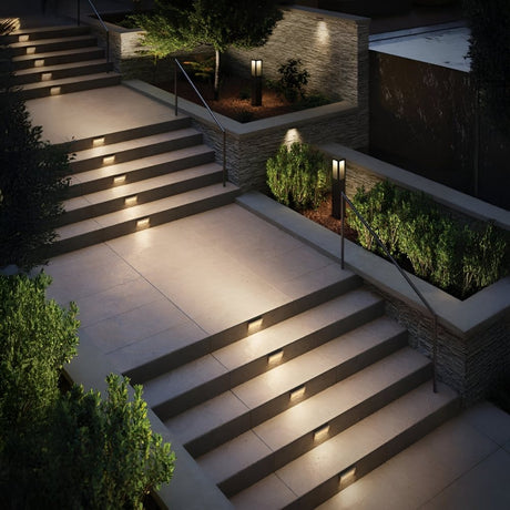 Outdoor staircase with built-in step lights highlighting the landscaped design.
