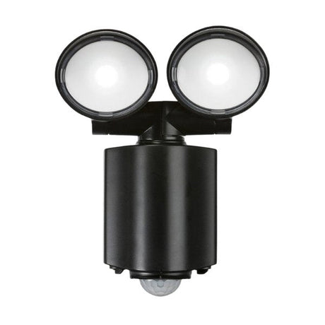 A black outdoor security light fixture with two round, adjustable floodlights and a motion sensor at the bottom, photographed on a white background.
