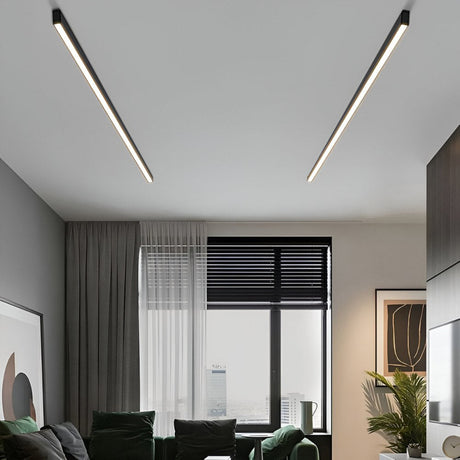 Modern living room with linear ceiling lights and large window.
