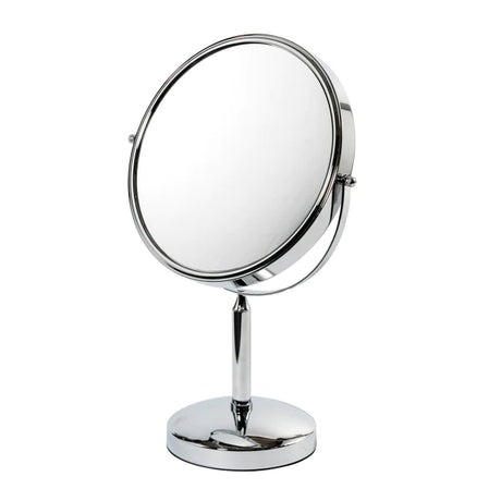 A round, standing vanity mirror with a metal frame and base. The mirror is tilted slightly and has a smooth, reflective surface, suitable for tabletop use.