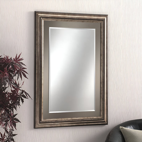 Bronze framed rectangular wall mirror in a living room