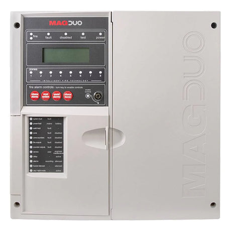 Fire alarm control panel labeled MAGDUO, featuring a digital display, buttons, and indicators for status alerts like fault, test, and power. The panel is gray with a door on the left side.