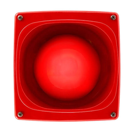 Red alarm button with a circular, raised surface, mounted on a red square base. Four screws are at each corner, securing the device. The central button has a glossy finish, indicating a prominent emergency alert device.