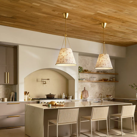 Modern kitchen with light wood accents, beige cabinets, a marble island with seating, and two floral pendant lights hanging above. The brand name HINKLEY appears at the bottom.