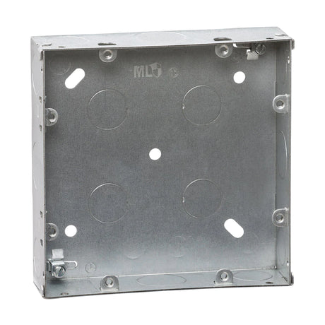 A metal electrical junction box with multiple knockout holes for wiring is shown. It has a square shape and pre-drilled screw holes for mounting.