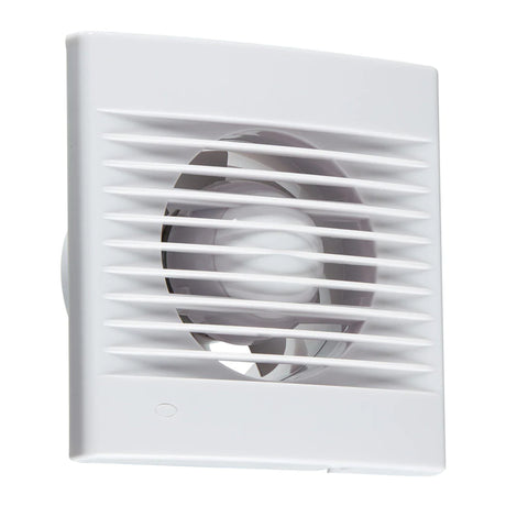 A white square ventilation fan with slatted grill cover is mounted on a wall. The design is sleek and modern, with a circular opening visible through the slats, designed for efficient airflow.