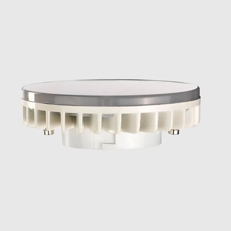 A round LED light fixture with a white base and a flat, opaque cover. The design features a series of cooling fins around the base for heat dissipation. Mounted on a neutral background.