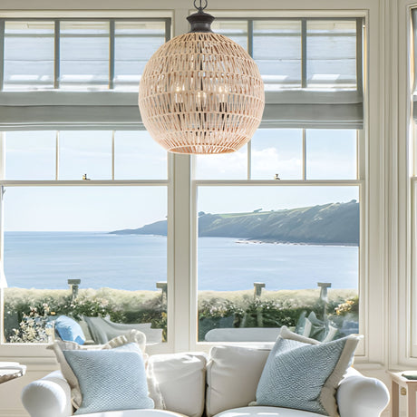 Woven rattan pendant light above a seating area