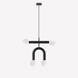 Rigoberta Duo Super Curved pendant light in matt black iron with four opal glass globes on a horizontal bar and curved arch, shown on a plain white background.