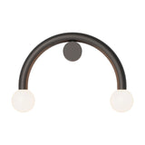 Rigoberta Curved Direct 2 Light wall light in matt black iron, a half-circle arch with an opal glass globe at each end and a round wall-mount canopy, shown on a plain white background.