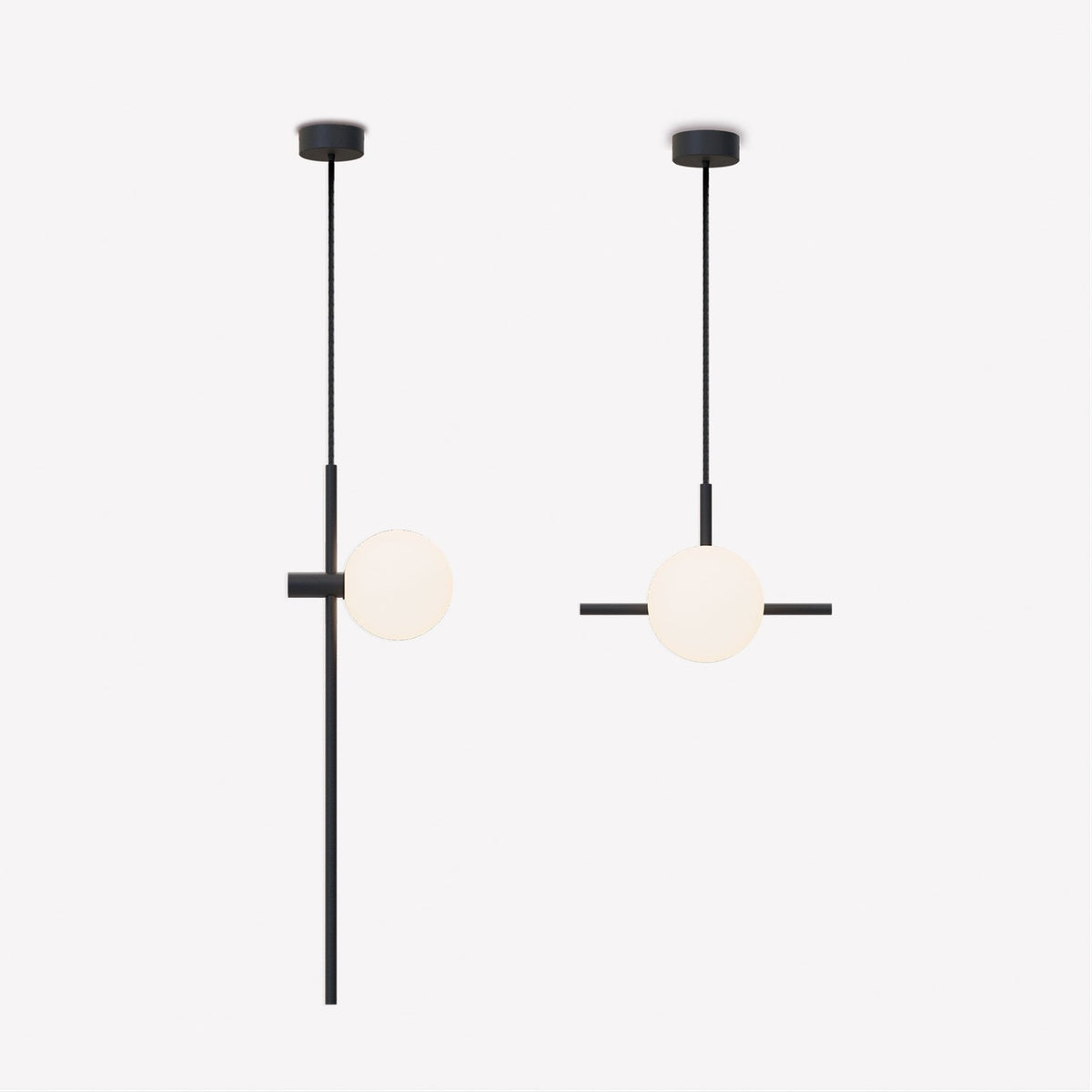 Two Roxanne North pendant lights in matt black with a slim rod, opal glass globe, and side rod detail, shown on a plain light background.