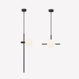 Two Roxanne North pendant lights in matt black with a slim rod, opal glass globe, and side rod detail, shown on a plain light background.