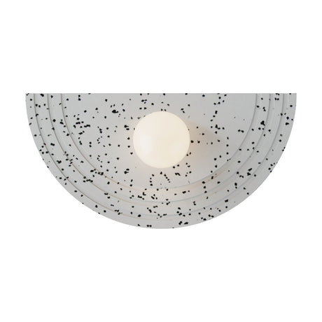Regina Globe Wall Light with a half-round, stepped Terrazzo White panel flecked with black, centred around a single lit opal glass globe, shown on a plain white background.