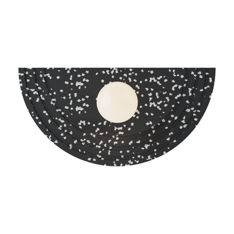 Regina Globe Wall Light with a half-moon black terrazzo structure flecked with white and a central opal glass globe, shown on a plain white background.