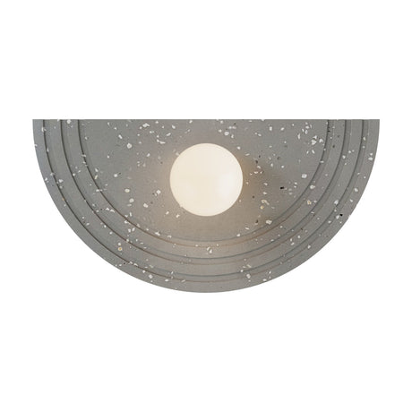 Regina Globe Wall Light with Terrazzo Structure in Terrazzo Grey, a half-moon fixture with concentric ringed grey terrazzo detailing and a single opal glass globe shade, shown on a white background.