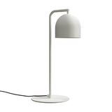 Rio Articulated Dome Adjustable Table Lamp in matt white, with a slim bent iron arm, round flat base, and small dome shade, shown on a plain white background.