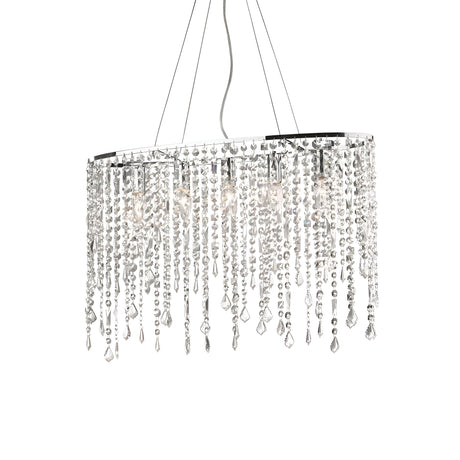 The Myst Crystal 5 Light Chandelier - Chrome, featuring an elegant oval design with cascading crystal elements and small light bulbs, is suspended from a white ceiling. The crystals produce a shimmering effect, enhancing the room's luxurious ambiance. Its adjustable length ensures it perfectly suits any ceiling height.