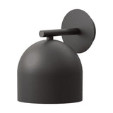 Rio Dome Wall Light in matt black iron, featuring a rounded dome shade on a short arm projecting from a round wall plate, shown on a plain white background.