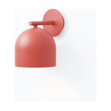 Rio Dome Wall Light in red, a single round dome shade on a short straight arm from a circular iron wall plate, shown on a plain white background.