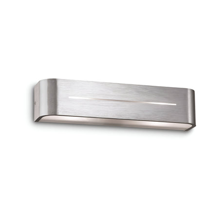 The Flare 2 Light Wall Light in grey boasts a modern, brushed-metal finish and a sleek rectangular shape with smooth edges. It is accented by a small horizontal slit on the front, providing dimmable lighting that softly illuminates the room.