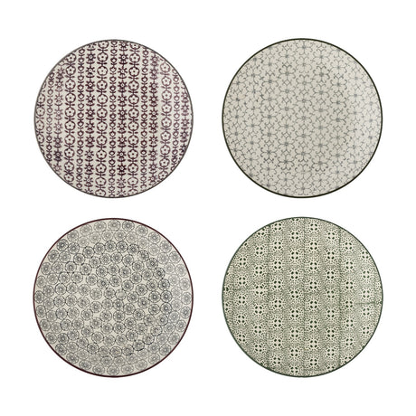 Karine ceramic side plates in four assorted designs with floral and geometric patterns in purple, grey, and black on white, shown on a plain background.
