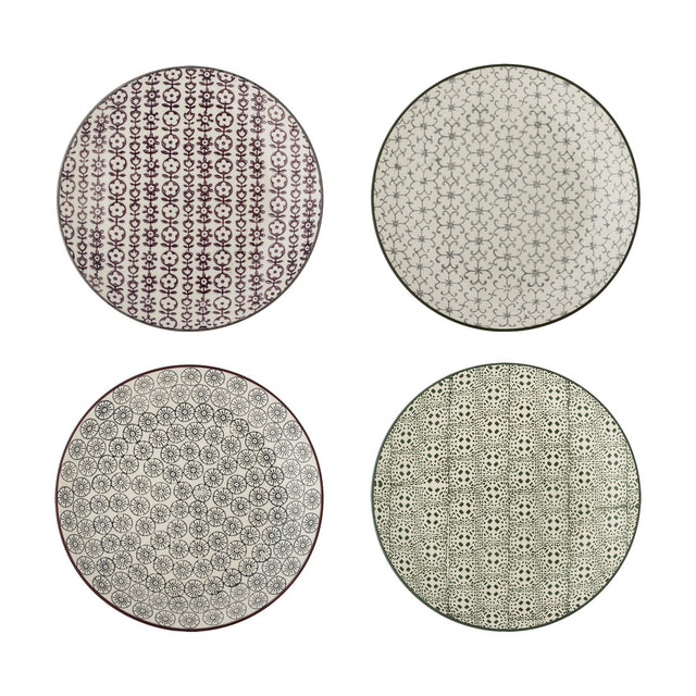 Karine ceramic side plates in four assorted designs with floral and geometric patterns in purple, grey, and black on white, shown on a plain background.