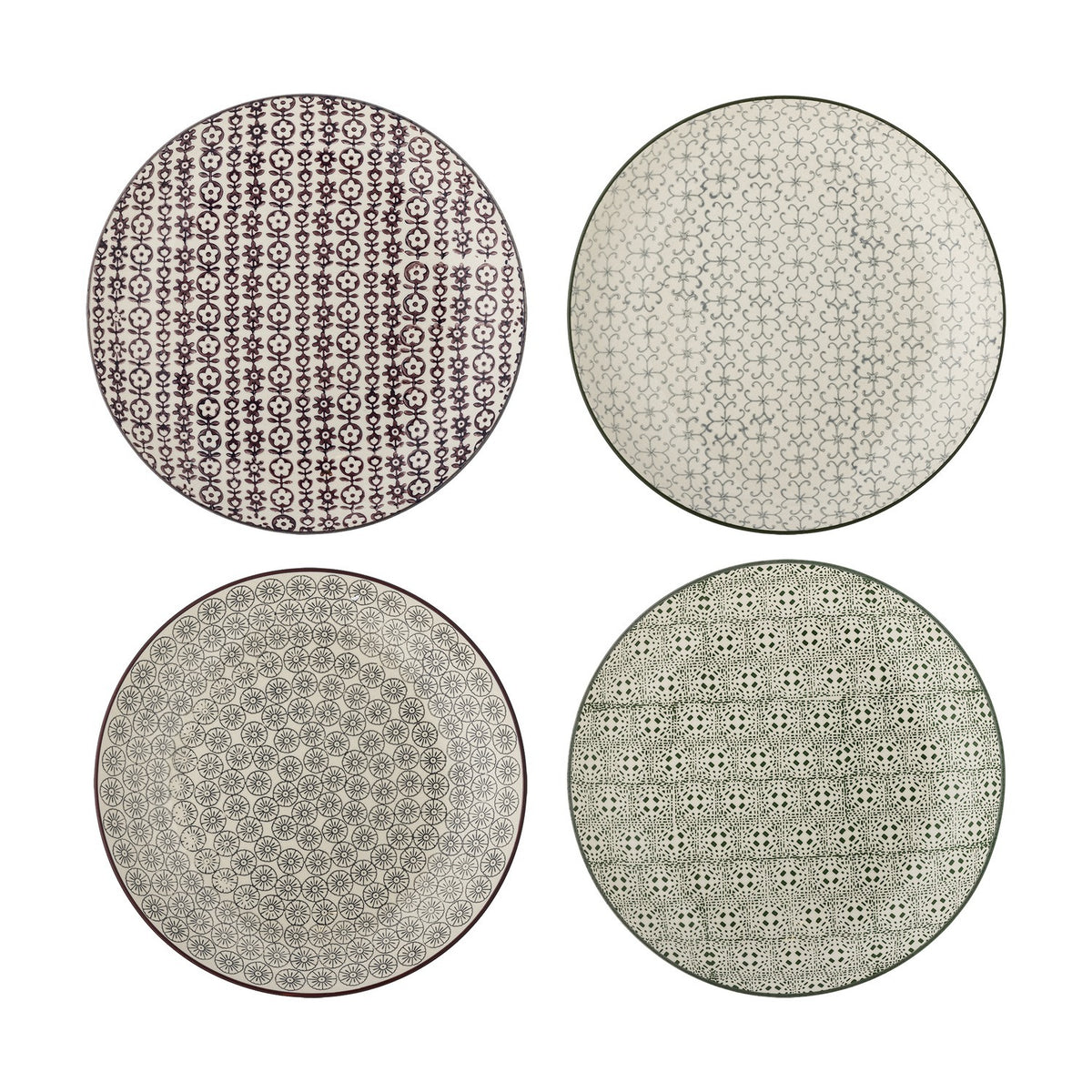 Karine Dinner Plate in four assorted stoneware designs with floral and geometric patterns in black and white tones, shown on a plain white background.