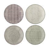 Karine Dinner Plate in four assorted stoneware designs with floral and geometric patterns in black and white tones, shown on a plain white background.