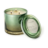Hinoki Sage Glass Scented Candle 590g in a green glass jar with three lit cotton wicks, shown with its round glass lid beside it on a white background.