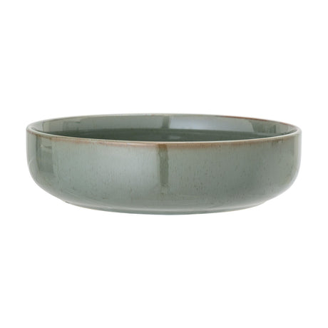 Pixie Stoneware Bowl 24cm in green, a wide low ceramic bowl with straight sides, a soft curved base, and a fine brown-toned rim edge, shown on a plain white background.