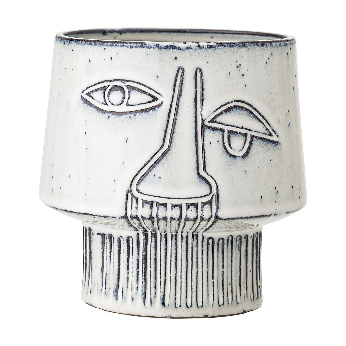 Sacad stoneware plant pot in white, featuring a raised-line face design with one open eye, one closed eye, a long nose, and ribbed footed base, shown on a plain background.