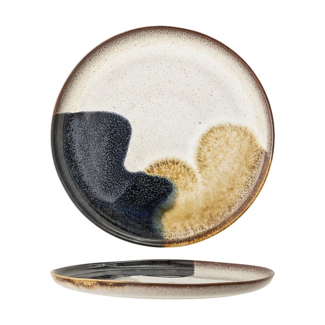 Jules Stoneware Dinner Plate in Multi, round stoneware plate with reactive glaze in cream, navy, and tan tones and a dark speckled rim, shown front and side on a white background.