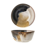 Jules Stoneware Bowl 13cm in Multi, shown from top and side, with a glossy reactive glaze in black, cream, and tan tones flowing down the exterior, on a plain white background.