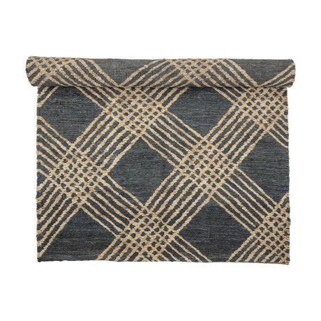 Cat Jute Rug 245x150cm in blue, partly rolled, showing a flat woven diagonal lattice pattern forming diamond shapes, on a plain white background.
