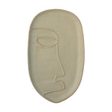Ngan Stoneware Tray in muted green, an oval ceramic dish with a raised rim and a single-line face design in profile, shown on a plain white background.