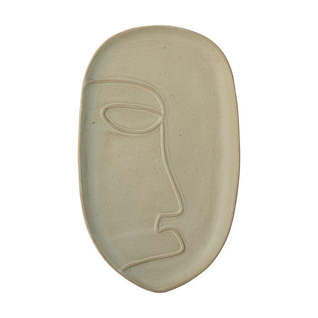 Ngan Stoneware Tray in muted green, an oval ceramic dish with a raised rim and a single-line face design in profile, shown on a plain white background.