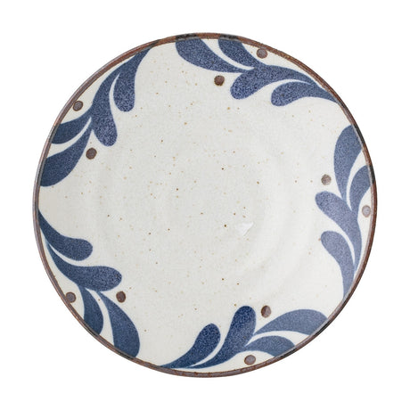 Camellia Porcelain Plate in cream, a small round side plate with speckled surface, blue leaf border and dots, dark rim line, on a plain white background.