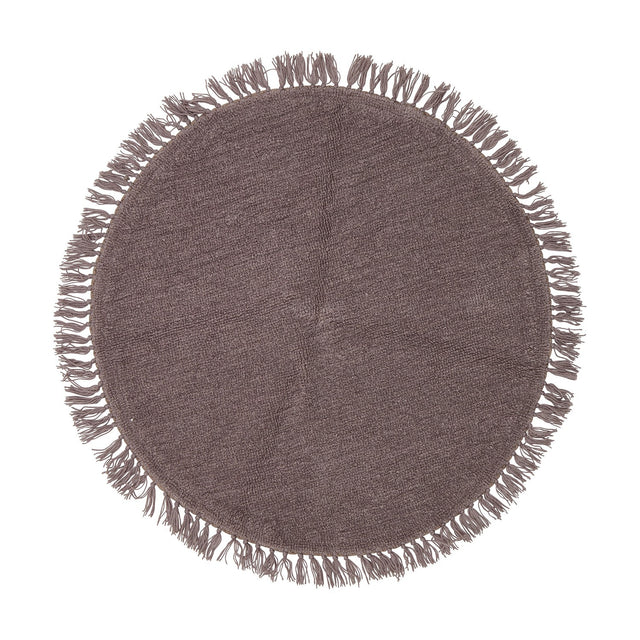 Lenea Round Wool Rug, 110cm, in purple with a tufted surface and matching fringe trim around the edge, shown on a plain white background.