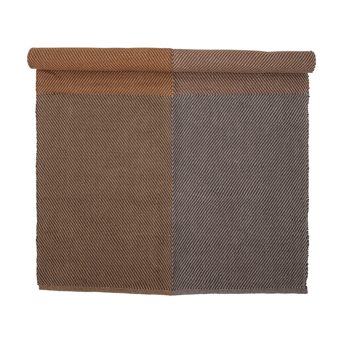 Rodin Jute Rug 200x140cm in Brown, partly rolled to show a diagonal twill weave in two colour-block shades of brown, on a plain white background.