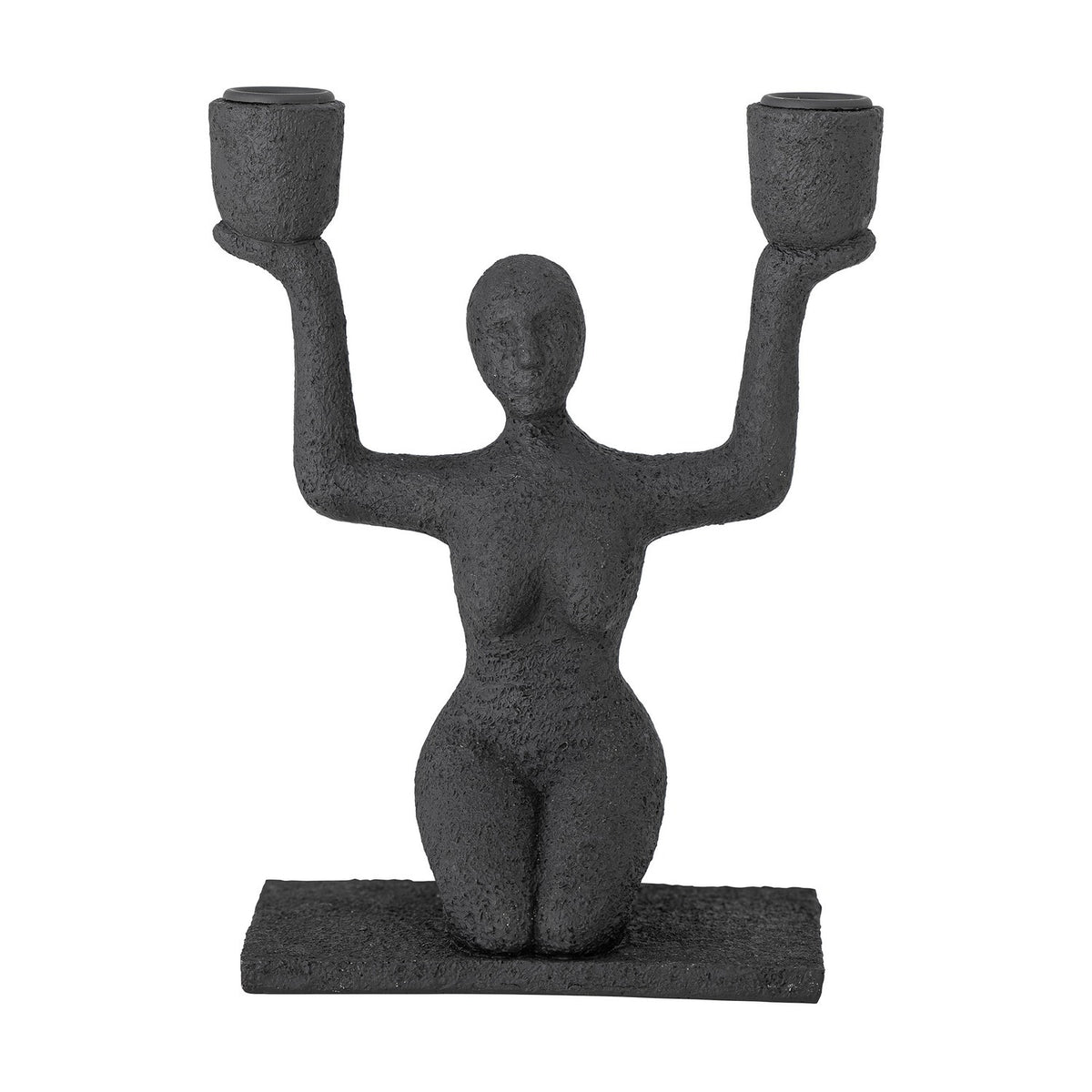 Lucie Resin Candle Holder in black, a textured kneeling female figure raising both arms to hold two cup-shaped candle holders, on a flat rectangular base against a plain white background.