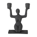 Lucie Resin Candle Holder in black, a textured kneeling female figure raising both arms to hold two cup-shaped candle holders, on a flat rectangular base against a plain white background.