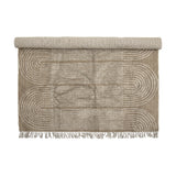Zeynep Cotton Rug 215x150cm in brown, partially rolled, showing a tufted arch pattern with fringed edges on a plain white background.