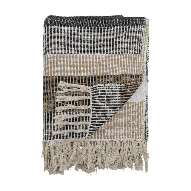 Isnel Black Striped Cotton Throw folded to show black, beige and white woven stripes with knotted fringe, against a plain white background.