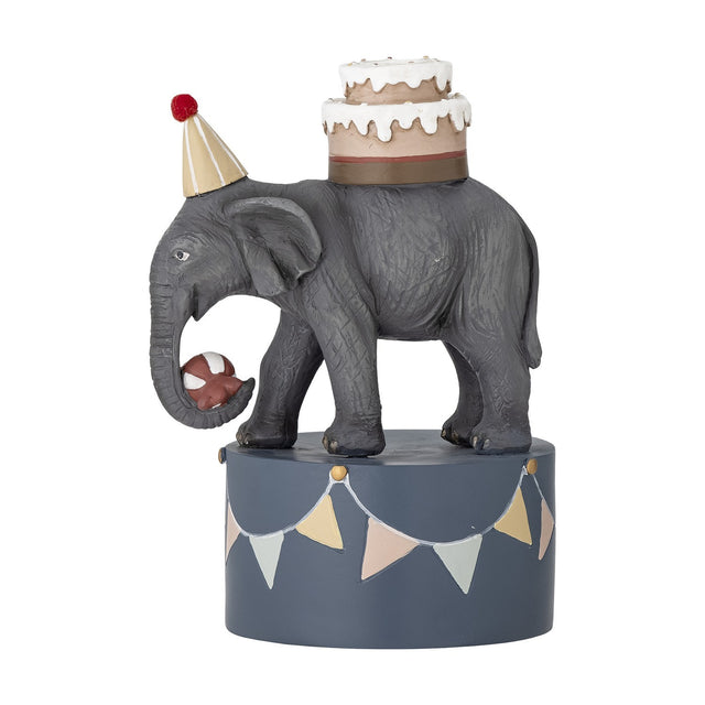 Flor Resin Candle Holder 18cm in multicoloured resin, shaped as an elephant in a party hat balancing a two-tier cake and ball, on a bunting-decorated round base, plain white background.