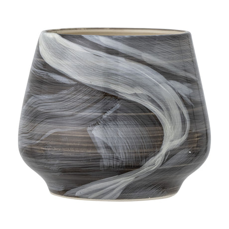 Skjalm stoneware plant pot in grey, round tapered shape with hand-painted light brushstrokes sweeping over a darker grey ground, set against a plain white background.