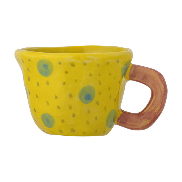 Nini Stoneware Cup 100ml in yellow, hand-painted with blue-green spots and tiny dots, featuring a terracotta-toned loop handle and irregular rim, shown on a white background.