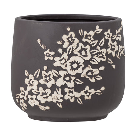 Betino Floral Stoneware Plant Pot in brown with a diagonal band of light-toned floral and leaf patterns, rounded tapered body on a small base, shown against a plain white background.