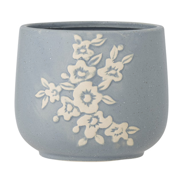 Betino Floral Stoneware Plant Pot in blue, round with a slightly tapered base, featuring a raised white floral spray design and speckled finish, shown on a plain white background.
