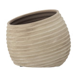 Cimmy Terracotta Plant Pot in beige, a rounded bowl-shaped planter with ribbed horizontal texture and a slanted rim, shown on a plain white background.